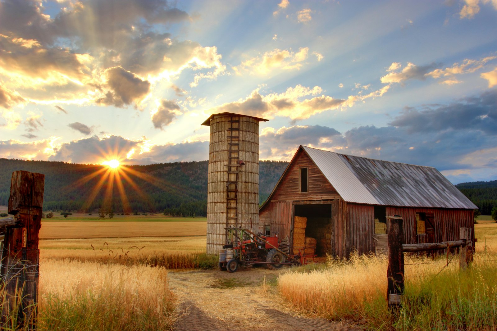 Farm barn and silo at golden hour